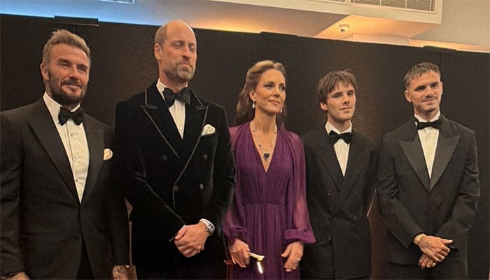 Prince Williams velvet jacket catches Tom Cruises eye as he reunites with David Beckham