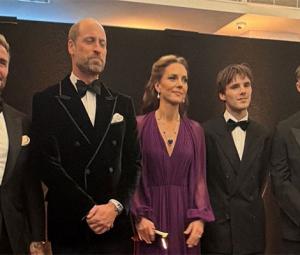 Prince William's velvet jacket catches Tom Cruise's eye as he reunites with David Beckham