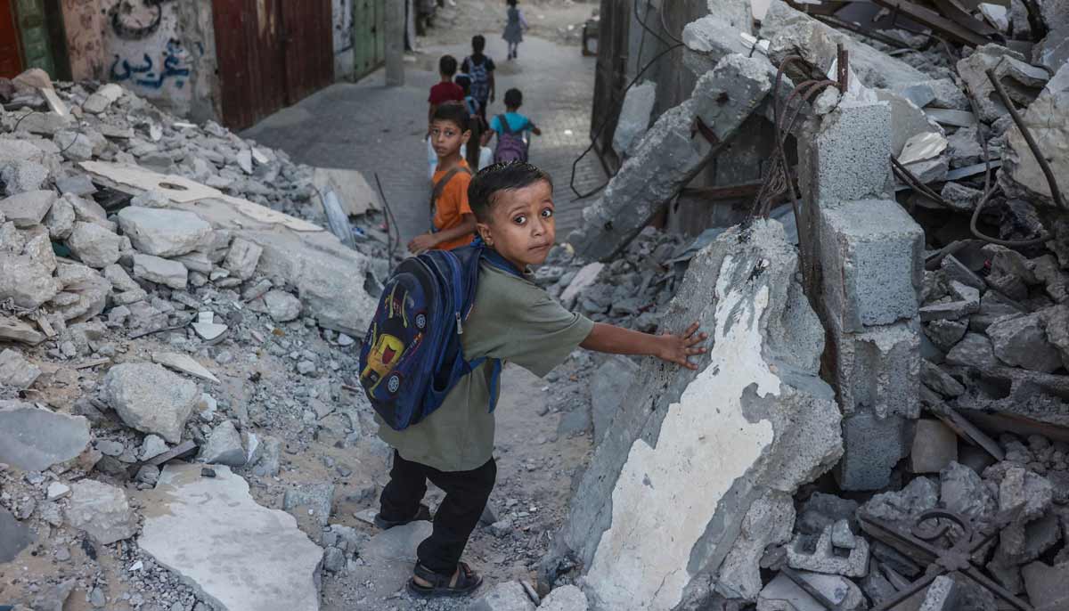 With reconstruction stalled, Gazans shelter in buildings at risk of collapse 31 Palestinian children walk to school amid the rubble of destroyed buildings as the academic year begins in Khan Yunis, in the southern Gaza Strip on September 19, 2026.— AFP