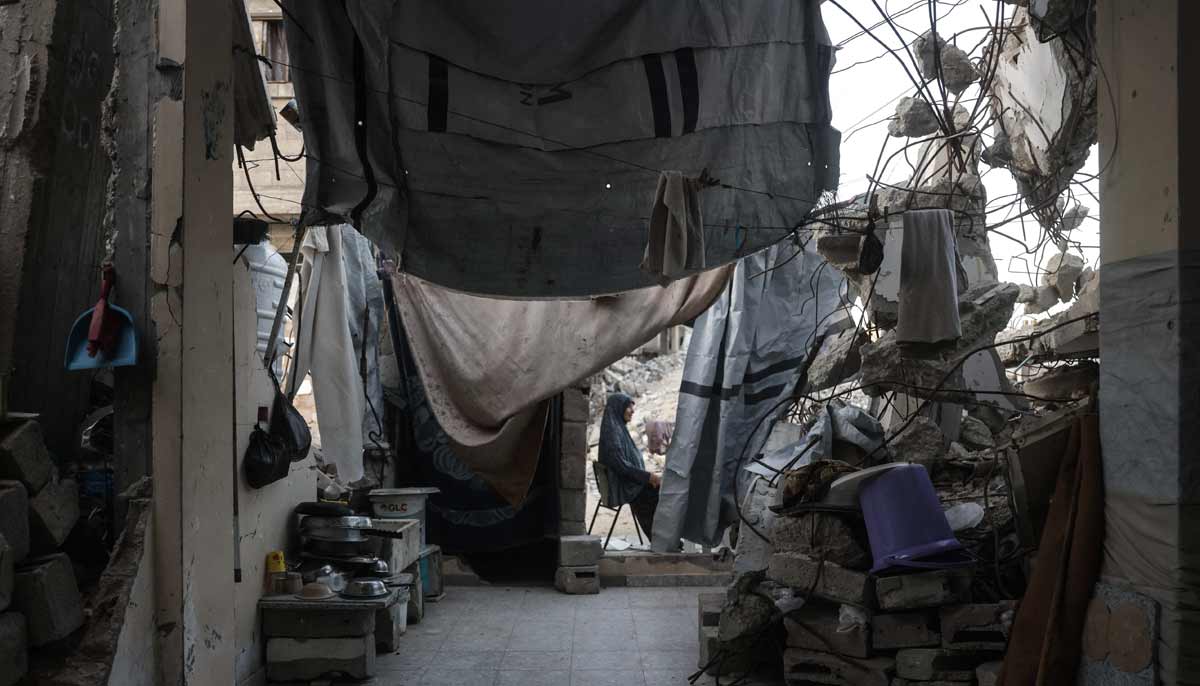 With reconstruction stalled, Gazans shelter in buildings at risk of collapse 26 A displaced Palestinian woman sits outside a heavily damaged building being used as a shelter in Khan Yunis in the southern Gaza Strip on September 19, 2026.— AFP