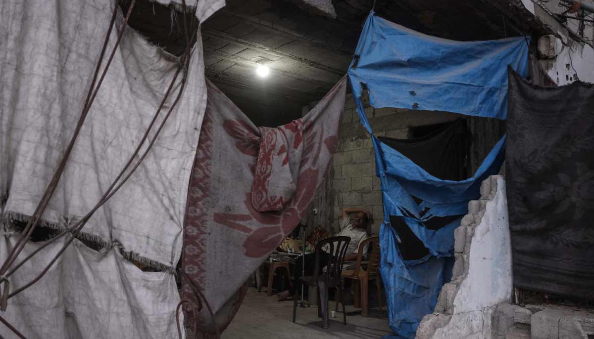 With reconstruction stalled, Gazans shelter in buildings at risk of collapse 24 A displaced Palestinian man sits inside a heavily damaged building being used as a shelter in Khan Yunis in the southern Gaza Strip on September 19, 2026. — AFP