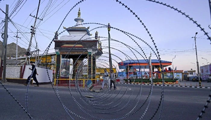 A barbed wire blocks a road during a curfew in Leh on September 25, 2025. — AFP
