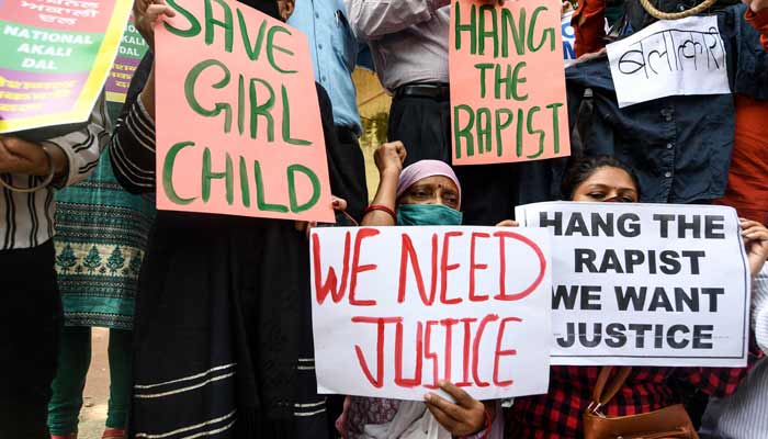 National Akali Dal party activists hold placards to protest against the alleged gang-rape and murder of women in India. — AFP/File