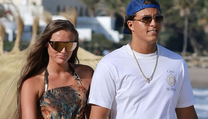 Venezuela Fury posed confidently in a white and pink designer dress, which she paired with a matching sunhat and shorts