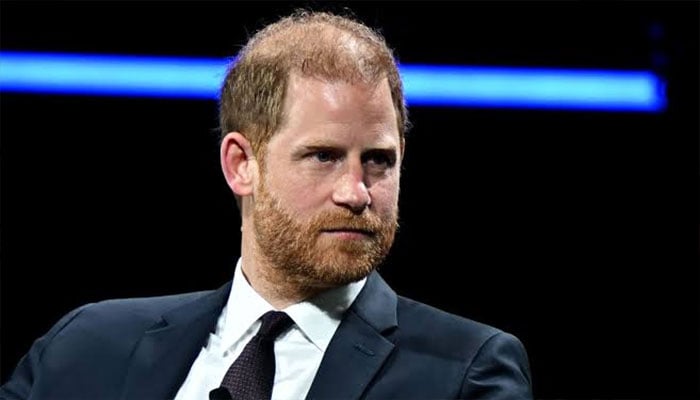 Prince Harry kisses ground after emotional skydive honouring 102-year-old veteran