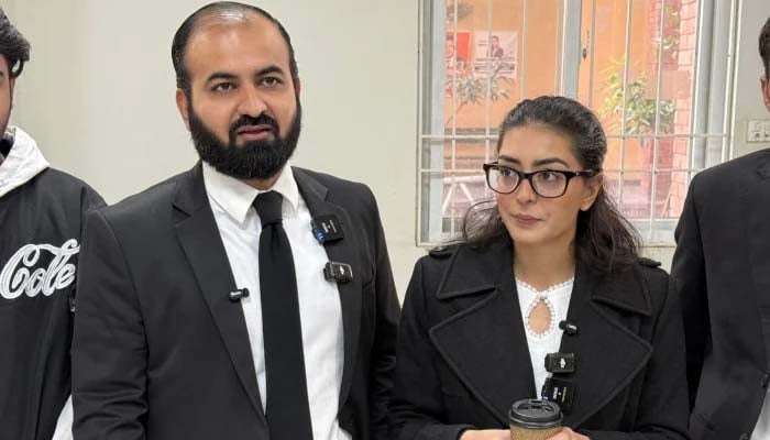 Human rights lawyer Imaan Mazari (right) with her husband and fellow lawyer Hadi Ali Chattha (left), during a court hearing in Islamabad on December 5, 2025. — AFP