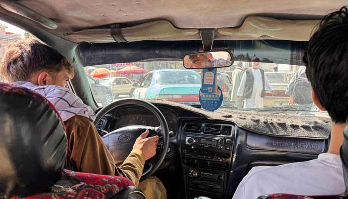 Rebellious Afghan taxi drivers defy ban on music 8 The picture shows a music playback screen on the stereo as an Afghan taxi driver transports passengers in Kabul. — AFP