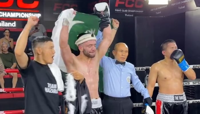 Pakistans boxing sensation Usman Wazeer (second left) celebrates after defeating Indonesias boxer Ari Agustian (right) in his 19th international world ranking fight in Pattaya, Thailand. — Screengrab via Instagram/usmanwazeerofficial