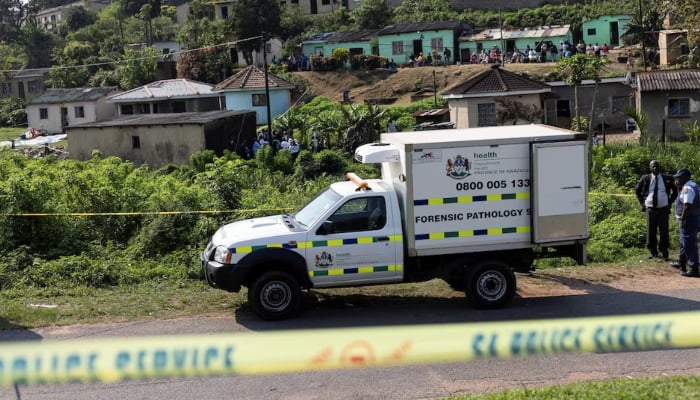 A forensic vehicle is parked near the scene where several people were killed and several others injured, in the township of KwaMakhutha near Durban, South Africa, September 23, 2026. — Reuters