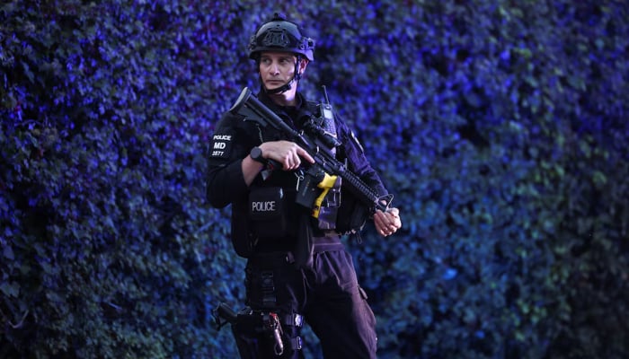 A police officer blocks a road near the RAF Fairford airbase, which hosts United States Air Force (USAF) personnel, in Fairford, Gloucestershire, Britain, September 27, 2026. — Reuters