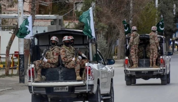 Security personnel patrol with vehicles on a street in Quetta, Balochistan. — AFP/File