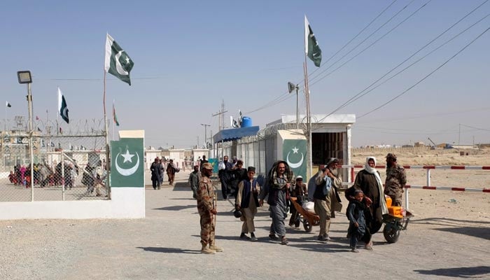 Citizens wait their turn to enter from Afghanistan at the border-crossing town of Chaman, Pakistan, October 5, 2017. — Reuters