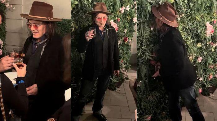 Johnny Depp raises a toast before pulling off bizarre leaf stunt