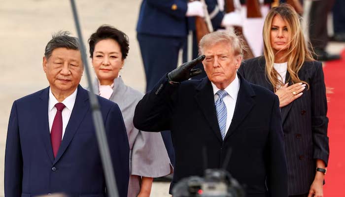 US President Donald Trump, US first lady Melania Trump, Chinas President Xi Jinping and his wife Peng Liyuan listen to the US national anthem upon their arrival at Joint Base Andrews, Maryland, US, September 23, 2026. — Reuters