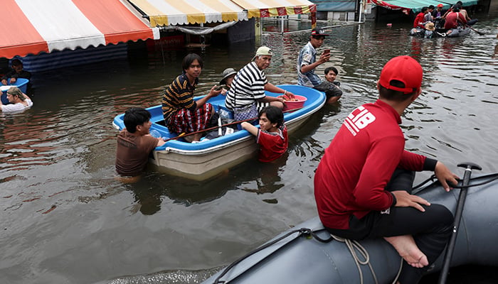 People travel by boats in a flooded street in Bangkok, Thailand, September 28, 2026. — Reuters