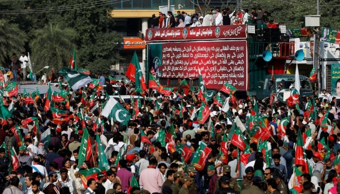 Supporters of PTI gather during a protest demonstration in Lahore on October 28, 2022. — Reuters