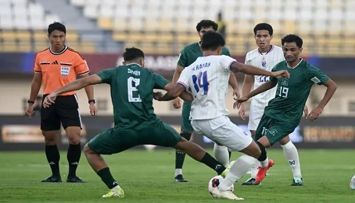 Pakistans Abdullah Shah (L) vies for the ball with Thailands Teerasak Poeiphimai during their Fifa Asean Cup Division 1, Group B match at the Si Jalak Harupat Stadium in Bandung, Indonesia, on Saturday. — X/PFF