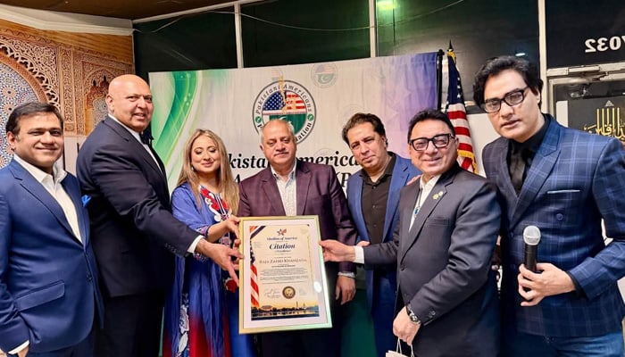 Muslims of America head Sajid Tarar (second left) presents certificates of appreciation during a reception and dinner in Washington. — Pakistani American Press Association