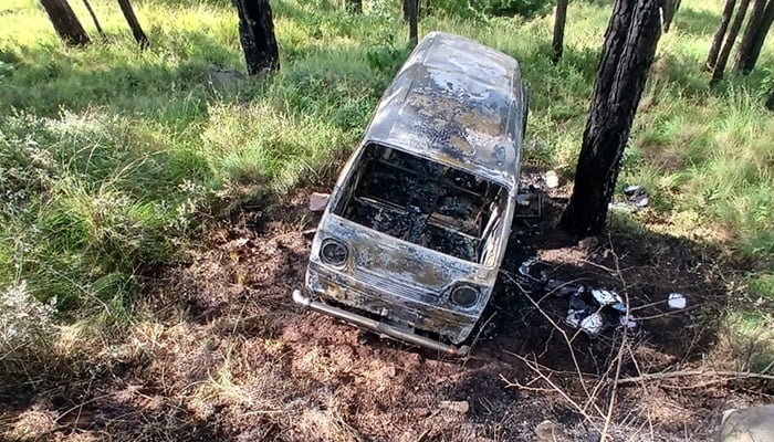 School van is seen after the fire was extinguished following the accident on Angoori Road in Murree on September 29, 2026. — Reporter