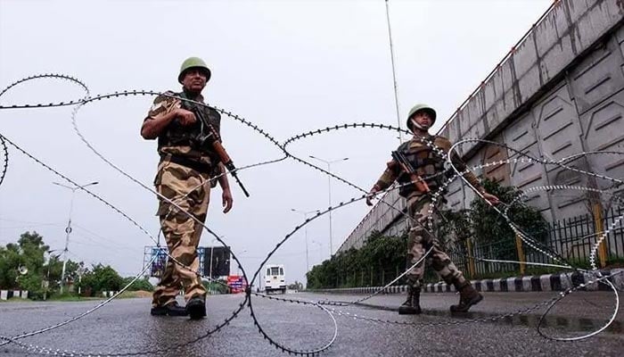 Security personnel stand guard at a roadblock in Jammu on August 7, 2019. — AFP/File
