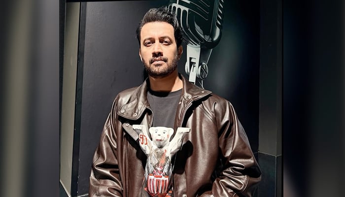 Atif Aslam posing with the bear trophy he received after performing at Berlins Uber Arena. — Instagram@atifaslam