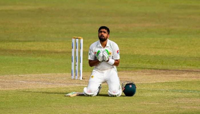 Pakistans red ball captain Babar Azam celebrates after scoring a century (100 runs) during Test match between Sri Lanka and Pakistan at the Galle International Cricket Stadium in Galle on July 17, 2022. - AFP