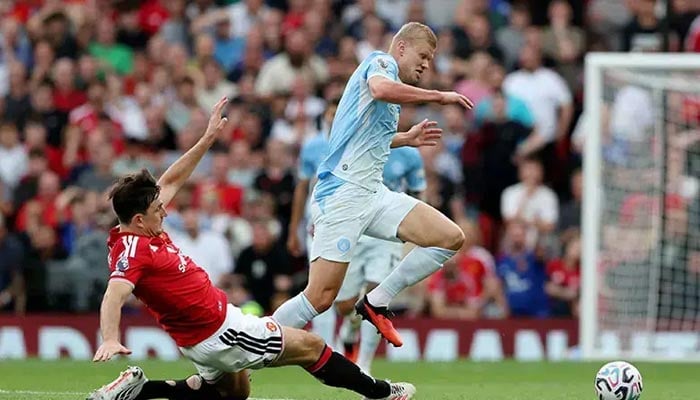 Harry Maguire (Left) of Manchester United attempts to tackle Manchester City’s Erling Haaland during their Premier League match at Old Trafford on Sunday, September 13, 2026. — Reuters