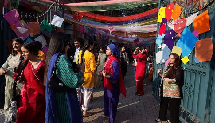 People take selfies with kites on display to mark Basant, a kite-flying festival, in Lahore, February 6, 2026. — Reuters