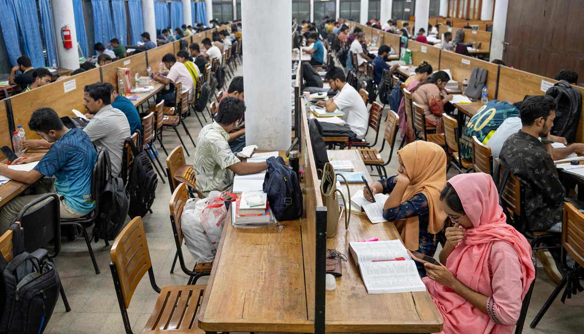 This picture shows students studying inside the library at Dhaka University in Dhaka.— AFP