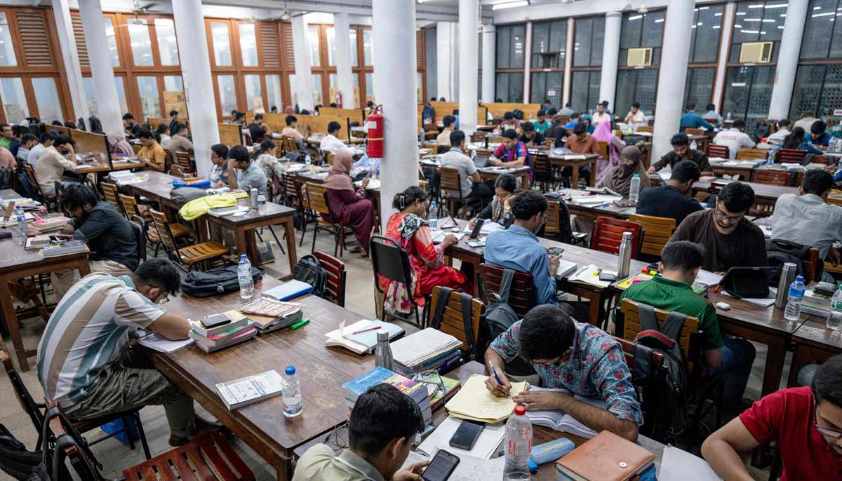 Students studying inside the library at Dhaka University in Dhaka. — AFP