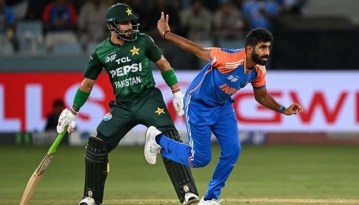 Indias Jasprit Bumrah (right) bowls as Pakistans Sahibzada Farhan watches during the Asia T20I Cup 2025 Super Four match between India and Pakistan at the Dubai International Stadium in Dubai on September 21, 2025. — AFP