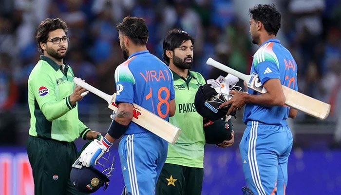 Indias Virat Kohli and Axar Patel shake hands with Pakistan players after the match. — Reuters/File
