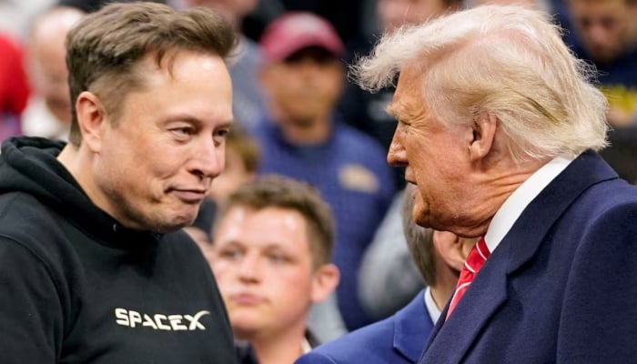 Tesla CEO Elon Musk greets US President Donald Trump as they attend the NCAA mens wrestling championships in Philadelphia, Pennsylvania, US, March 22, 2025. — Reuters