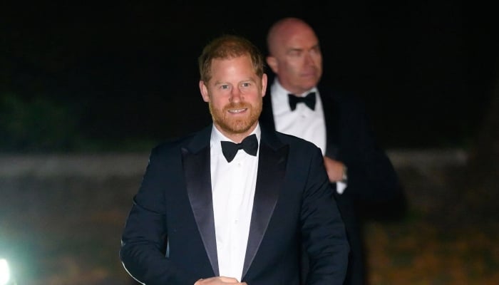 Prince Harry steps out in tuxedo for gala with special auction item from past