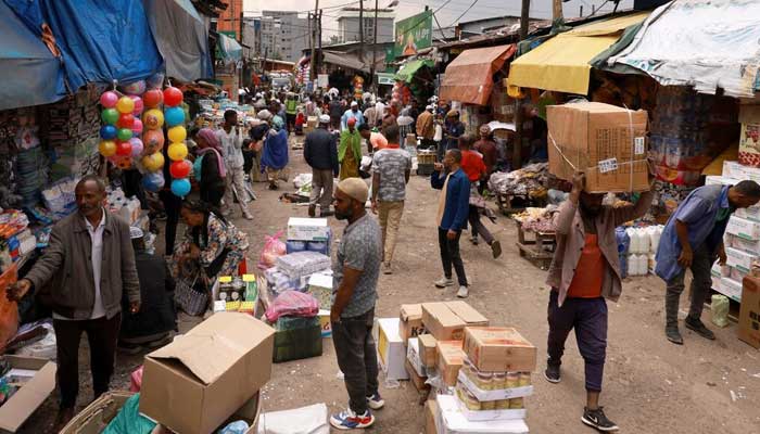 Shoppers walk within Merkato, one of Africas biggest open air market, in Addis Ababa, Ethiopia, April 25, 2024. — Reuters