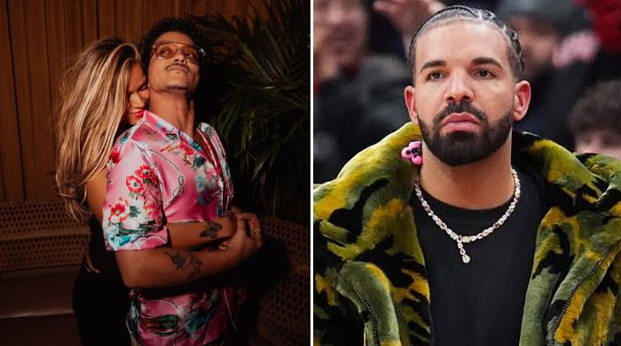 Bruno Mars wins back Karol G from Drake with ‘Dance With Me' music video