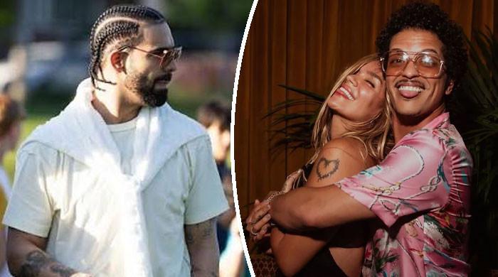 Drake reacts after Bruno Mars gets Karol G back in new video