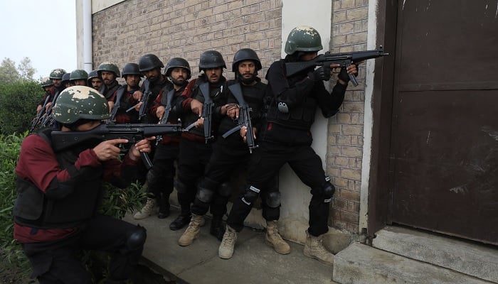 Police officers take positions during a counter terrorism training session at the Elite Police Training Centre in Nowshera, Pakistan, February 10, 2023.  —Reuters