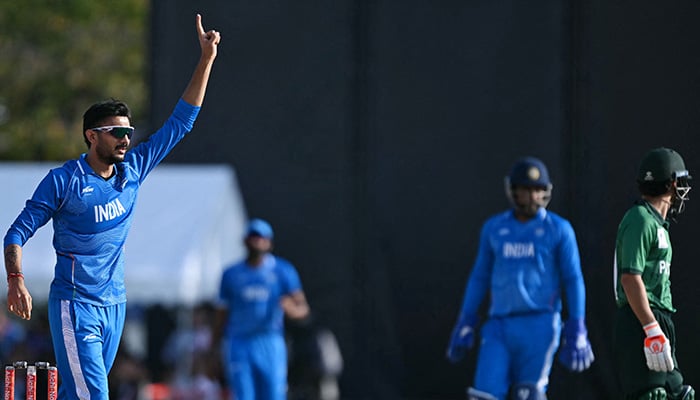 Indias Axar Patel (L) celebrates the dismissal of Pakistans Usman Khan (R) during the mens cricket final match between Pakistan and India during the 2026 Asian Games at the Korogi Athletic Park in Nisshin on October 3, 2026. — AFP