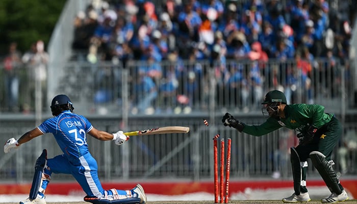 Indias Ishan Kishan (L) avoids getting stumped during the mens cricket final match between Pakistan and India during the 2026 Asian Games at the Korogi Athletic Park in Nisshin on October 3, 2026. — AFP