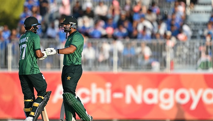 Pakistans Hasan Nawaz (L) and teammate Abdul Samad gesture during the mens cricket final match between Pakistan and India during the 2026 Asian Games at the Korogi Athletic Park in Nisshin on October 3, 2026. — AFP