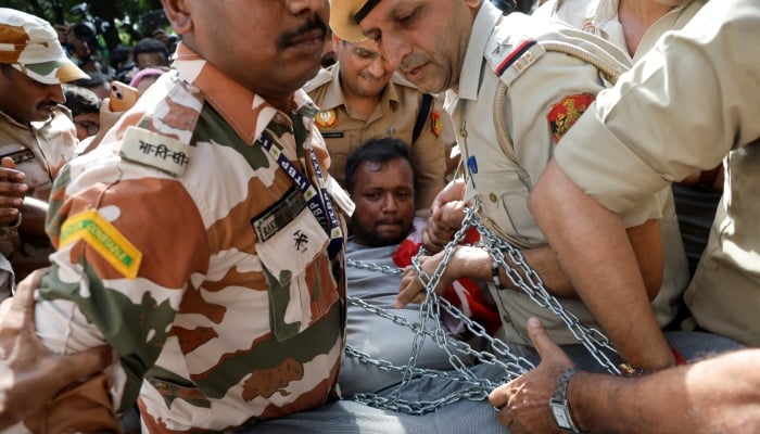 Police detain a demonstrator during a protest demanding the resignation of Indias Chief Election Commissioner Gyanesh Kumar, in New Delhi, India, October 3, 2026.  — Reuters