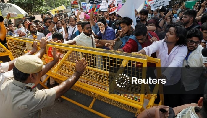 Demonstrators push against a police barricade during a protest demanding the resignation of Indias Chief Election Commissioner Gyanesh Kumar, in New Delhi, India, October 3, 2026. — Reuters
