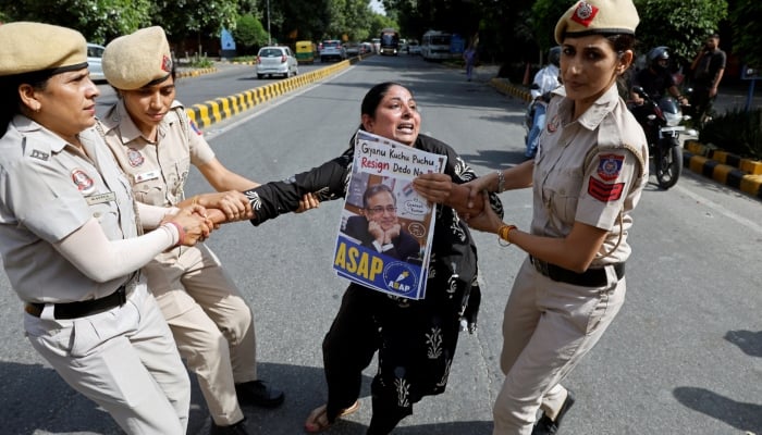 Police detain a demonstrator during a protest demanding the resignation of Indias Chief Election Commissioner Gyanesh Kumar, in New Delhi, India, October 3, 2026.  — Reuters