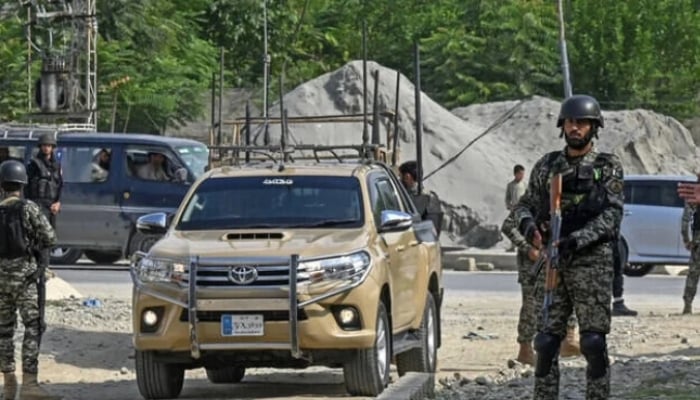 Security personnel stand guard in Bajaur district of Khyber Pakhtunkhwa. — AFP/File