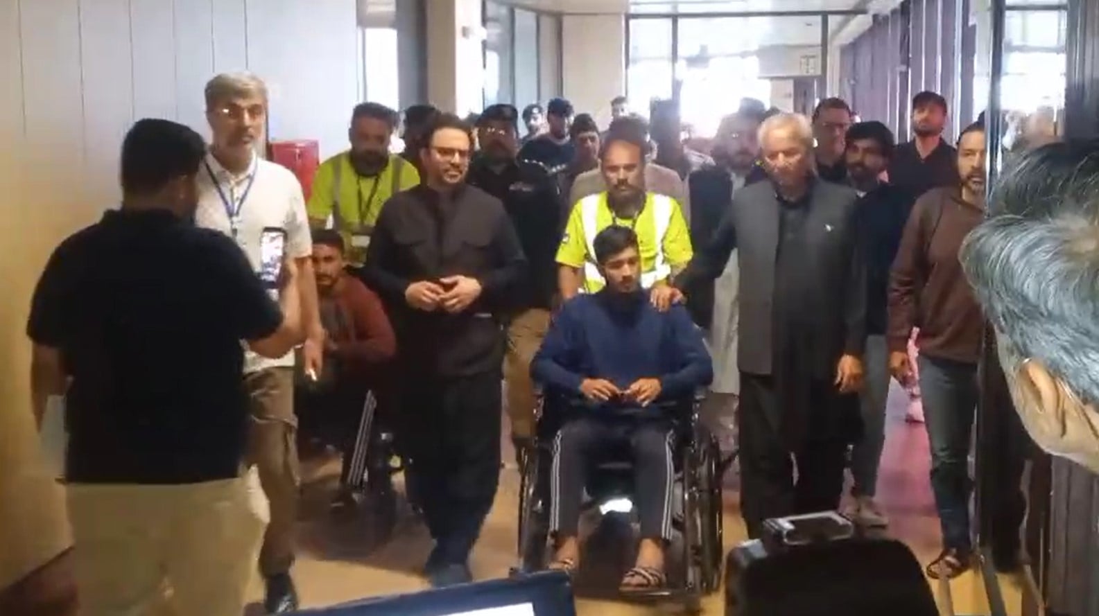 Pakistani crew members of MT Honour 25 exit Karachis Jinnah International Airport after returning from Djibouti on October 4, 2026.  — Geo News