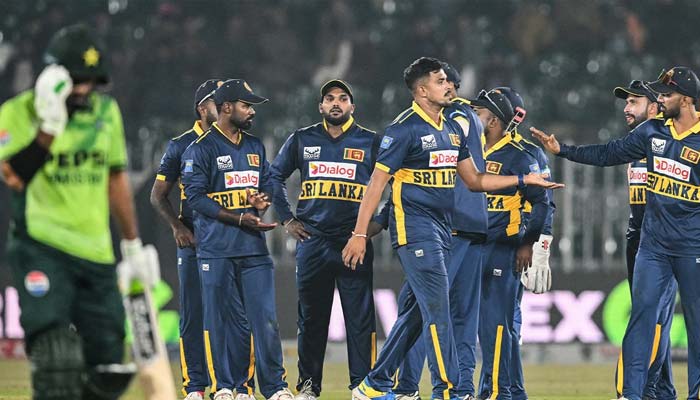 Sri Lankan teammates celebrate after taking the wicket of a Pakistani batter at the Rawalpindi Cricket Stadium on November 11, 2025. — AFP