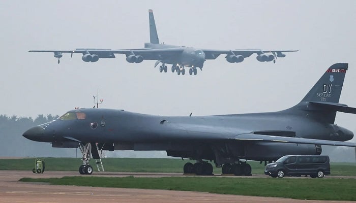 A US Air Force Boeing B-52 Stratofortress bomber lands behind a B-1B bomber parked at RAF Fairford, amid the US-Israeli conflict with Iran, in Fairford, England, March 9, 2026.— Reuters
