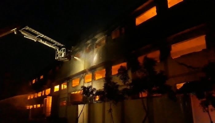 A file image shows thick smoke and flames rising from a factory during a fire in Karachis Landhi area. — Screengrab/Geo News