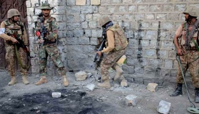 In this file photo, security forces are seen taking position during an operation. — ISPR/File